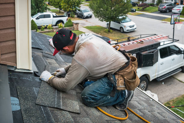 Professional Roof Replacement technician working in Lake Mills, WI
